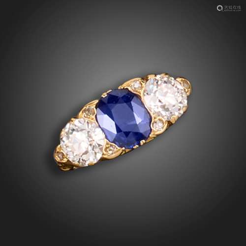 A sapphire and diamond three-stone ring, the cushion-shaped ...