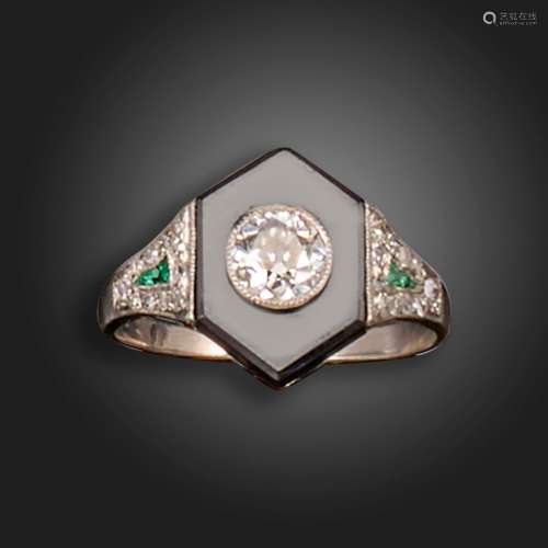 An Art Deco onyx, diamond and emerald ring, the hexagonal on...