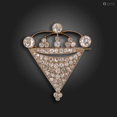 An early 20th century diamond brooch, the triangular body su...