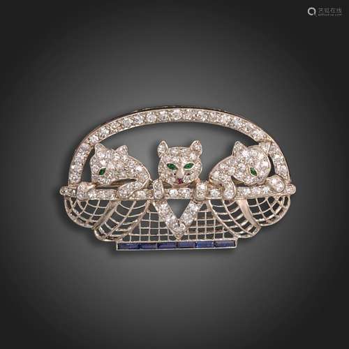 An early 20th century brooch by Cartier, designed as three p...