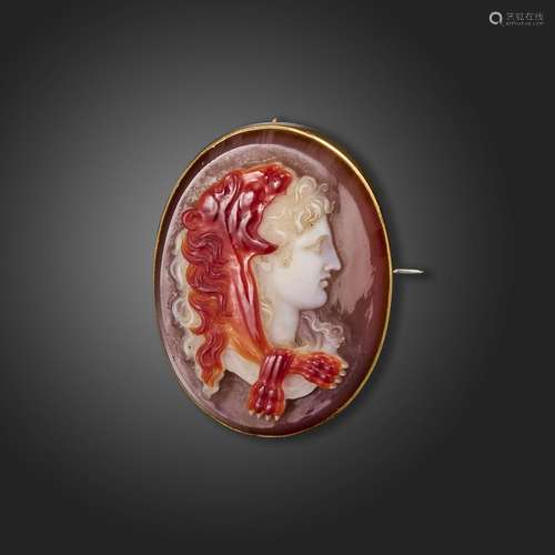 A 19th century sardonyx cameo-mounted gold brooch, depicting...