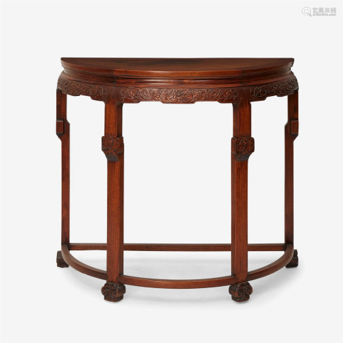 A Chinese carved hardwood demilune table 硬木月牙桌 The shap...