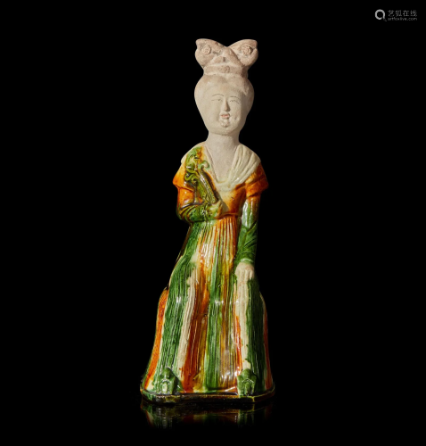 A Chinese sancai-glazed pottery figure of a seated woman 唐三...