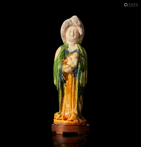 A very rare Chinese sancai-glazed pottery figure of a woman ...