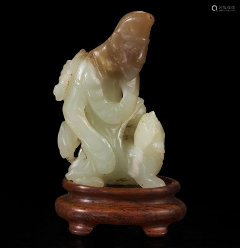 A rare Chinese jade carving of a foreigner and mythical beas...