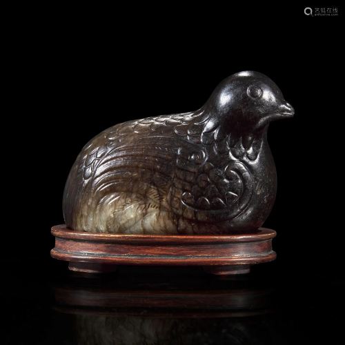 A Chinese dark blackish-brown and grey jade carving of a qua...