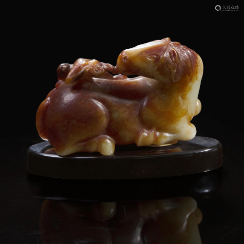 A Chinese yellowish and russet jade "Horse and Monkey&q...