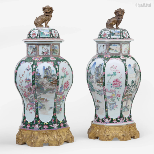 An impressive associated pair of famille rose-decorated porc...