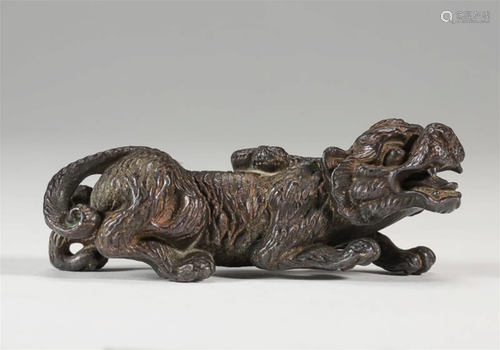 A Chinese Carved Bronze Paper Weight of Tiger Shape