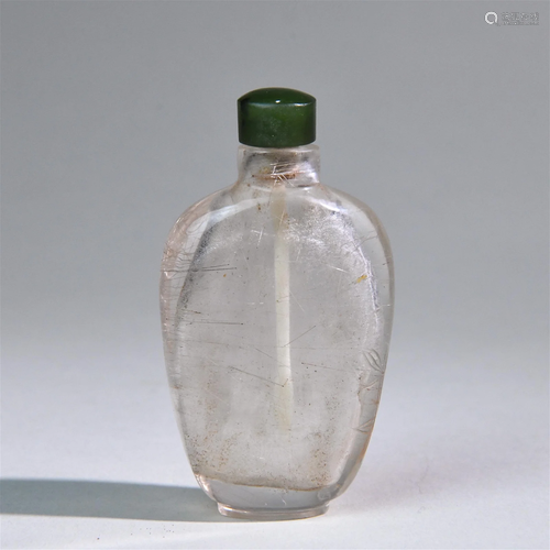 A Chinese Carved Crystal Snuff Bottle with Lid