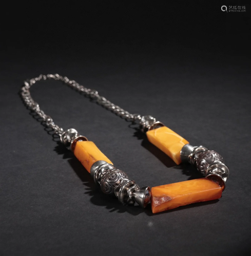 A Silver Necklace with Beeswax Decoration