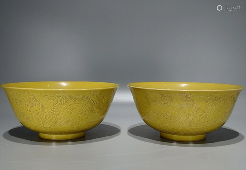 Pair of Chinese Carved Yellow Ground Glazed Porcelain Bowls