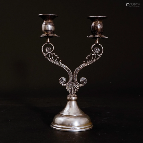 A antique candle holder