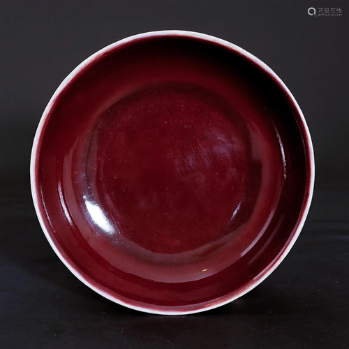 A red glaze plate in the Jiaqing period of the Qing Dynasty