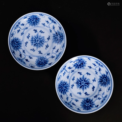 A pair of underglaze blue plates with a floral patternin the...