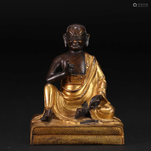 A Sino-Tibetan Bronze Partly Gilt Seated Master