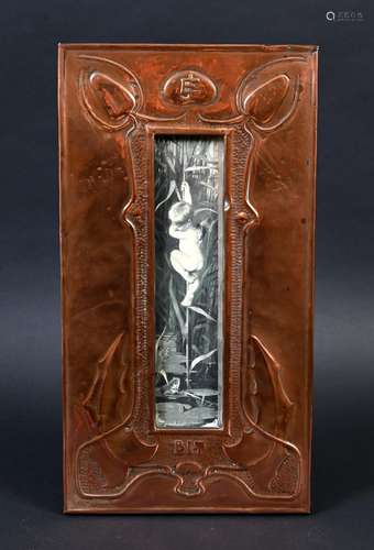 ARTS & CRAFTS COPPER FRAME with a stylised floral design...