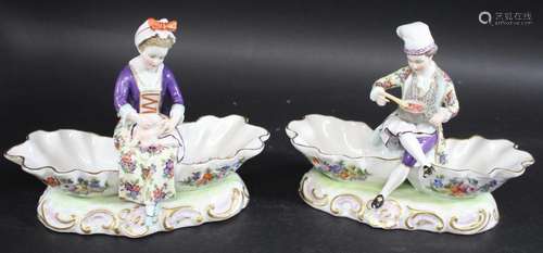 PAIR OF GERMAN PORCELAIN FIGURAL SHELL DISHES a pair of figu...