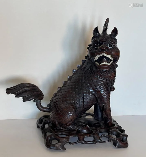 A Qing Dynasty Carved Wood Qilin