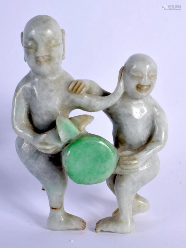 A RARE EARLY 20TH CENTURY CHINESE CARVED JADEITE EROTIC FIGU...