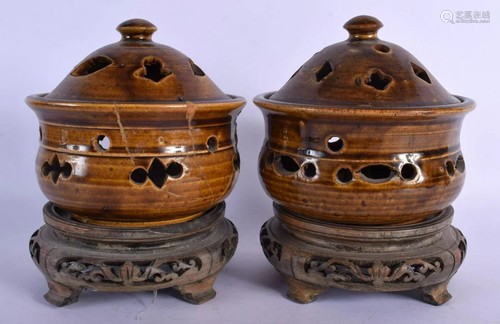 A PAIR OF 19TH CENTURY CHINESE BROWN GLAZED CENSERS AND COVE...