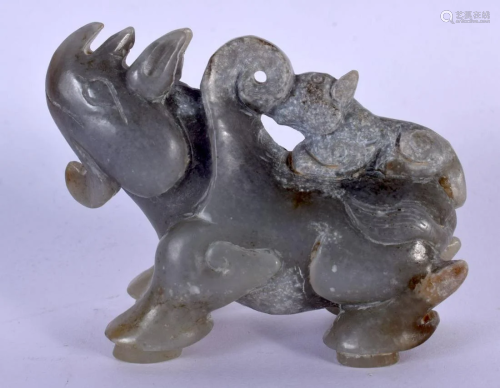 AN EARLY 20TH CENTURY CHINESE CARVED JADE FIGURE OF A RHINOC...