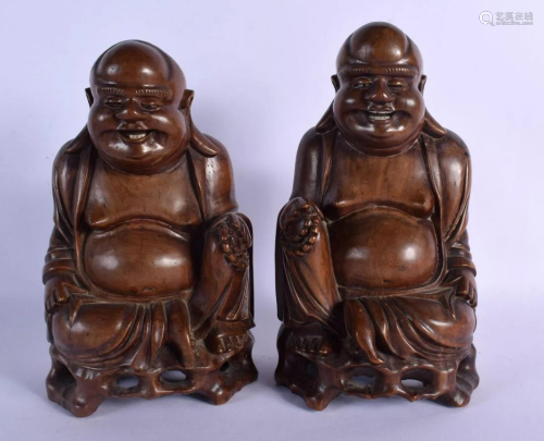 A PAIR OF 19TH CENTURY CHINESE CARVED HARDWOOD FIGURE OF BUD...