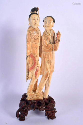 A 19TH CENTURY CHINESE POLYCHROMED IVORY FIGURE OF TWO FEMAL...