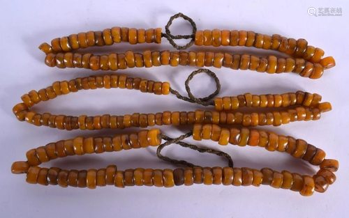 THREE 19TH CENTURY TIBETAN AMBER PRAYER BEAD NECKLACES of re...