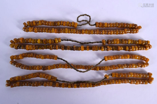 FOUR 19TH CENTURY TIBETAN AMBER PRAYER BEAD NECKLACES of reg...