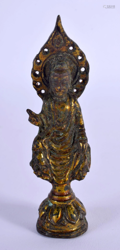 A CHINESE GILT BRONZE FIGURE OF A STANDING BUDDHISTIC VOTIVE...