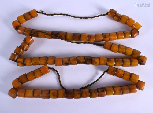 THREE 19TH CENTURY TIBETAN AMBER PRAYER BEAD NECKLACES of re...