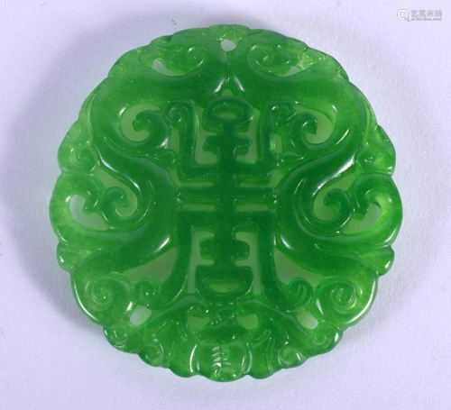 A CHINESE APPLE JADE CIRCULAR ROUNDEL PENDANT 20th Century. ...