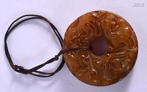 AN EARLY 20TH CENTURY CHINESE YELLOWISH GREEN JADE CHILONG P...