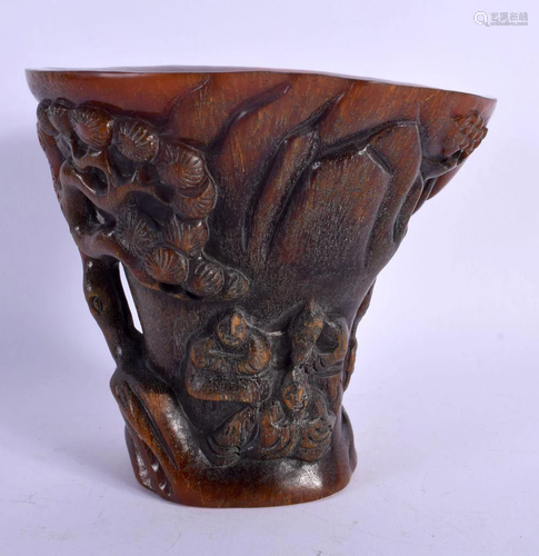 A LARGE CHINESE CARVED BUFFALO HORN TYPE LIBATION CUP of nat...