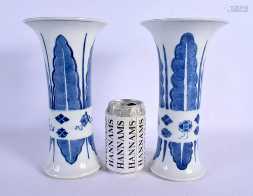 A PAIR OF 19TH CENTURY CHINESE BLUE AND WHITE GU FORM BEAKER...