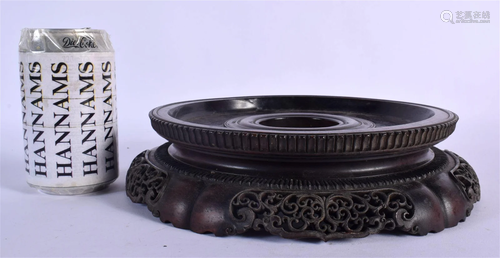 A LARGE 19TH CENTURY CHINESE CARVED HARDWOOD CIRCULAR STAND ...