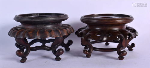 A NEAR PAIR OF 19TH CENTURY CHINESE HARDWOOD STANDS Qing. 12...