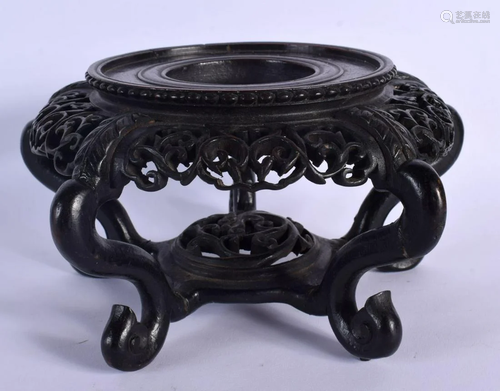 A 19TH CENTURY CHINESE CARVED HARDWOOD CIRCULAR STAND Qing, ...