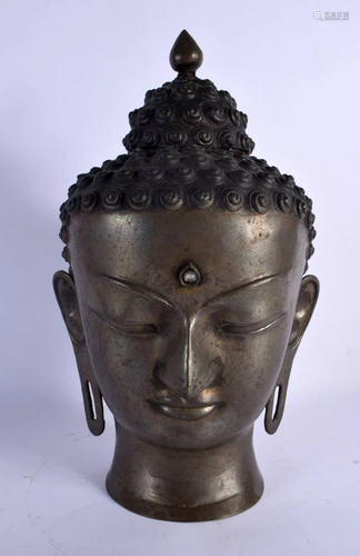 A LARGE 19TH CENTURY CHINESE BRONZE BUDDHA HEAD with moonsto...