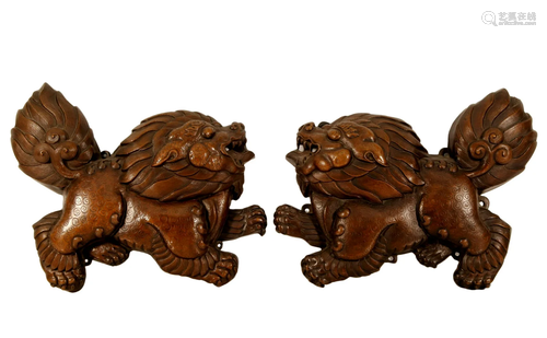 A Pair Of Bronze 'Lions' Pendants