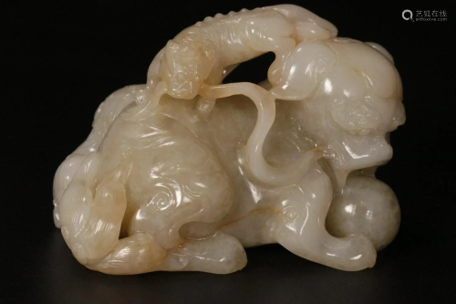 A Hetian Jade â€˜A Lion Playing With A Ball Made Of Strips O...