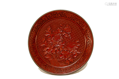 A finely carved flower pattern red laquar plate