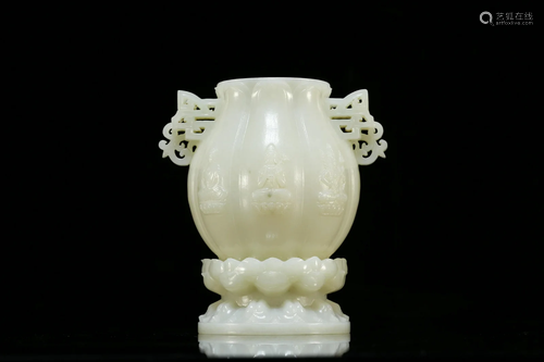 A White Jade Buddhist Figure Lotus Vase