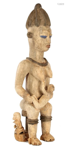 Wooden fertility statue of a woman with 2 children