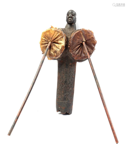 Wooden ceremonial blow bar with skin with sticks