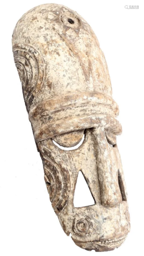 Wooden ceremonial mask decorated with white kaolin