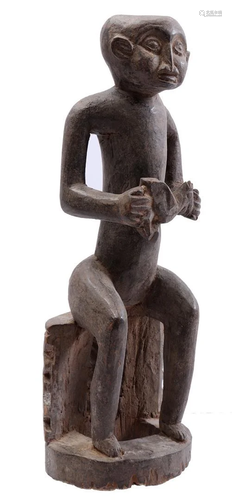 Wooden ceremonial statue, Man with bird