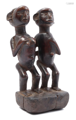 Cermonial wooden statue of a man and woman