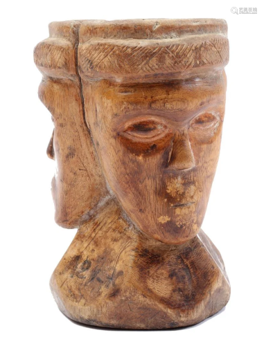 Wooden ceremonial cup with three faces